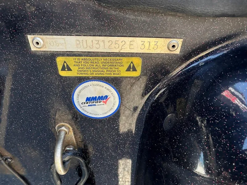 Slide: The Image of 2013 Nitro Z7 18' boat identification plate with warning label and certification sticker. - 11