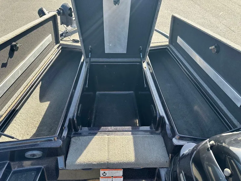 Slide: The Image of 2013 Nitro Z7 18' boat storage compartments open, showcasing ample space. - 14