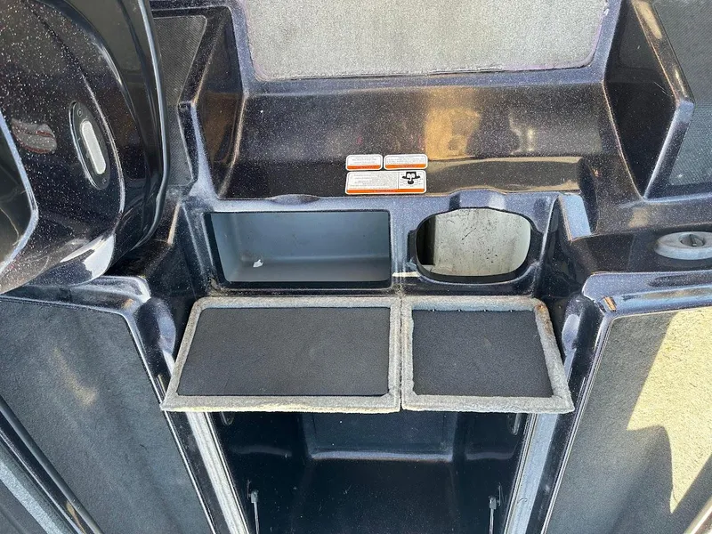 Slide: The Image of Interior storage compartments of a 2013 Nitro Z7 18' boat. - 15