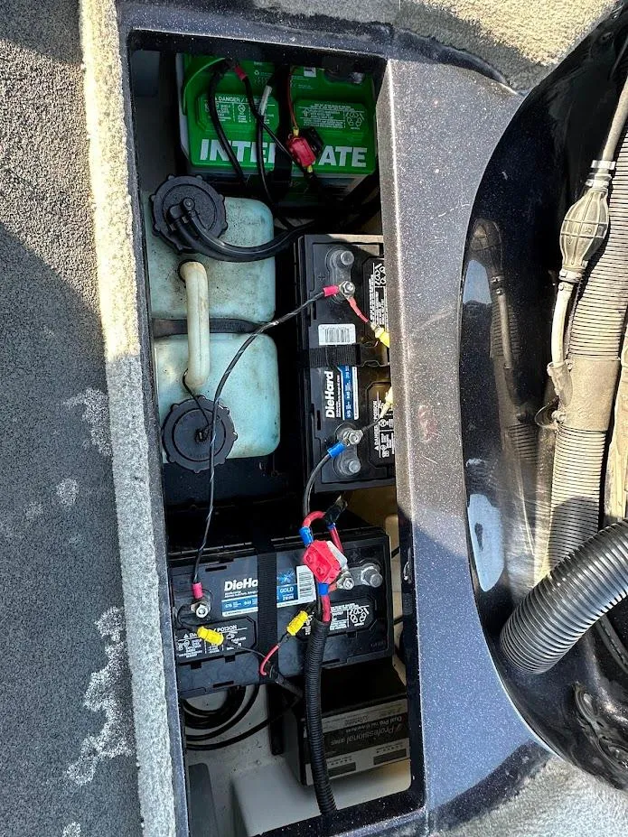 Slide: The Image of 2013 Nitro Z7 18' boat battery compartment with multiple batteries and wiring. - 17