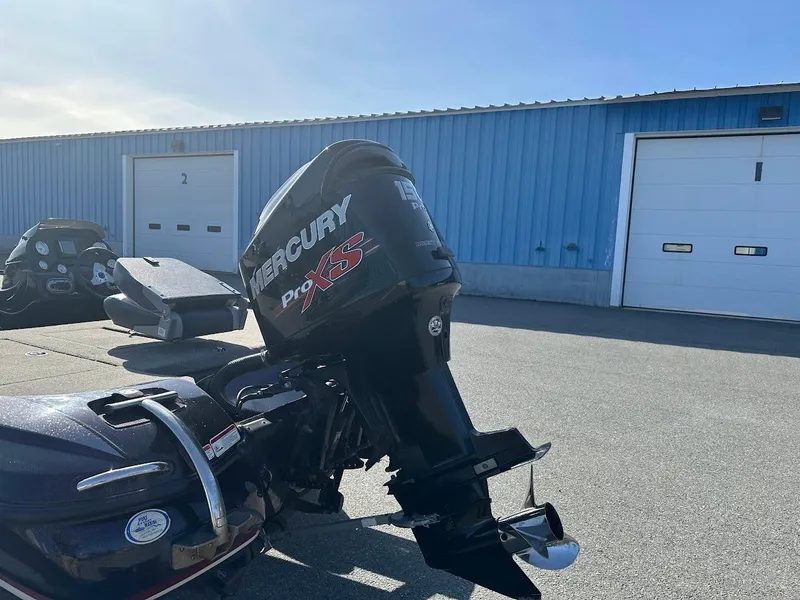 Slide: The Image of 2013 Nitro Z7 18' boat with Mercury Pro XS engine in a parking lot. - 6