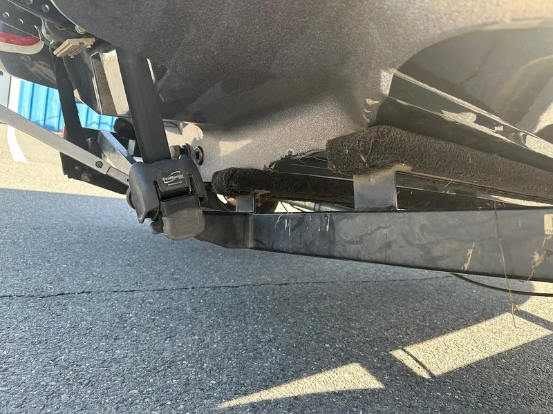 Slide: The Image of 2013 Nitro Z7 18' boat trailer hitch and support detail on pavement. - 9