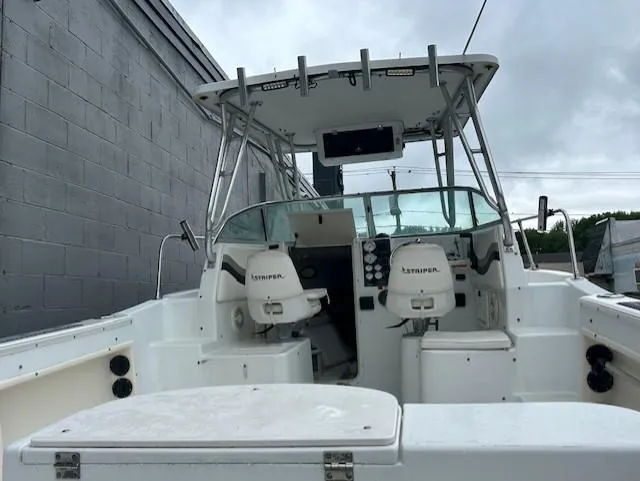 Slide: The Image of 2000 Seaswirl Striper 2600 Walkaround O/B boat with dual seats and canopy. - 3