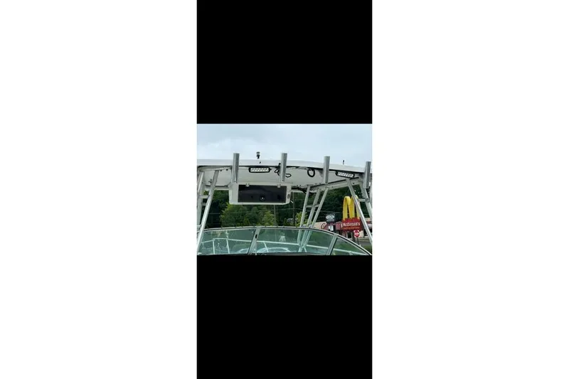 Slide: The Image of 2000 Seaswirl Striper 2600 Walkaround O/B boat with visible canopy and equipment. - 8