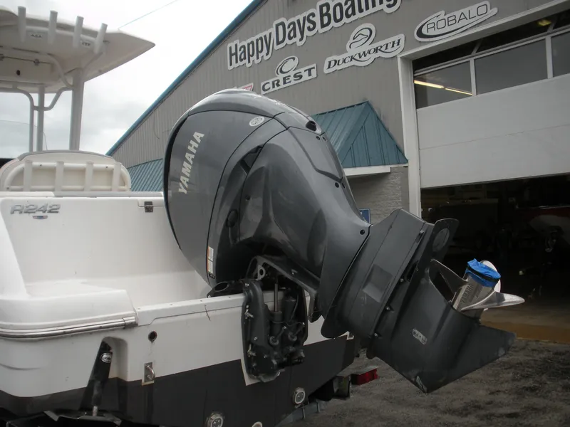 Slide: The Image of 2022 Robalo R242 Center Console boat with Yamaha engine at Happy Days Boating dealership. - 5