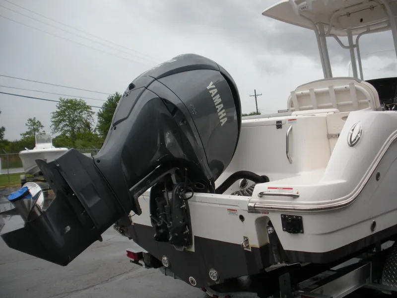 Slide: The Image of 2022 Robalo R242 Center Console with Yamaha outboard motor, rear view. - 6