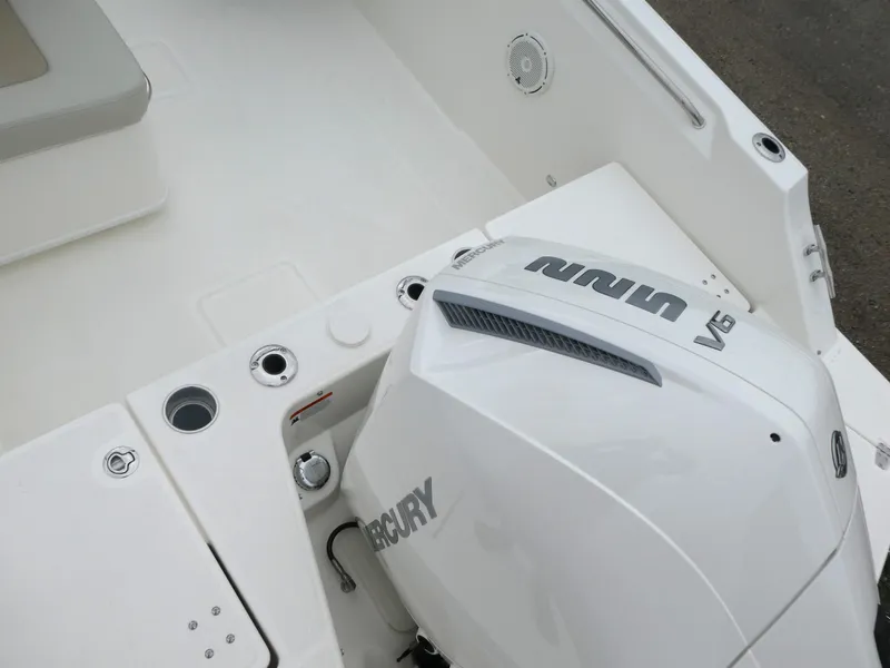 Slide: The Image of 2025 Boston Whaler 210 Vantage boat with Mercury V6 engine, white interior. - 8