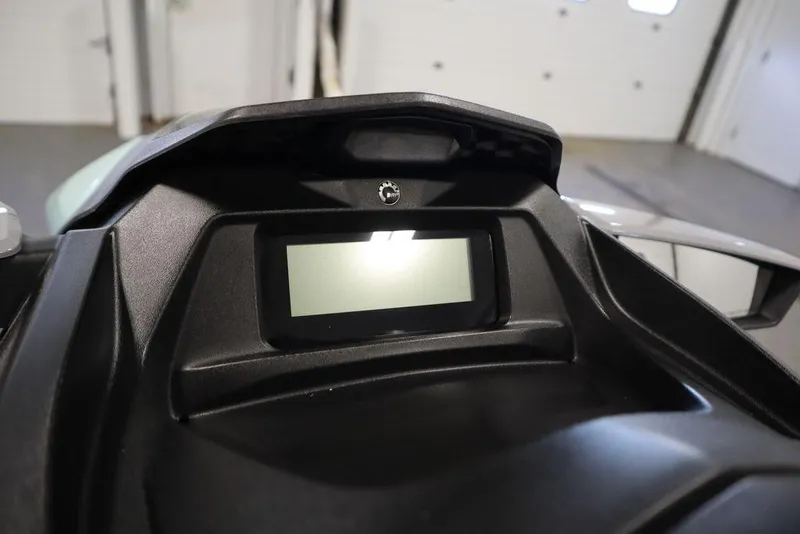 Slide: The Image of 2024 Sea-Doo GTI™ 130 dashboard display in a garage setting. - 4
