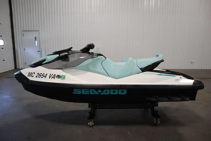 Slide: The Image of 2024 Sea-Doo GTI™ 130 jet ski in a showroom, side view. - 7