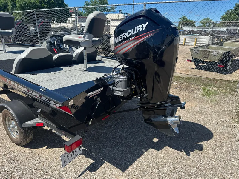 Slide: The Image of 2017 Tracker Pro Team 175 TXW boat with Mercury outboard motor, parked on a trailer. - 12