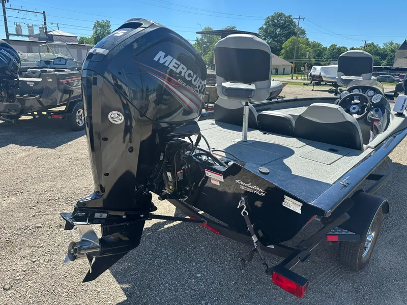 Slide: The Image of 2017 Tracker Pro Team 175 TXW boat with Mercury outboard motor, parked outdoors. - 13