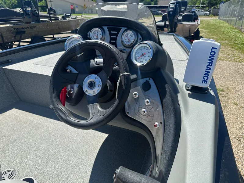 Slide: The Image of 2017 Tracker Pro Team 175 TXW boat dashboard with steering wheel and Lowrance device. - 14