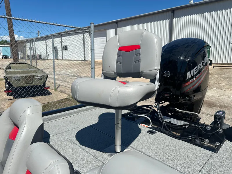 Slide: The Image of 2017 Tracker Pro Team 175 TXW boat with Mercury engine and comfortable seating. - 7