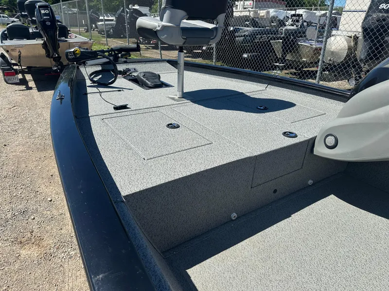 Slide: The Image of 2017 Tracker Pro Team 175 TXW fishing boat with gray deck and seating. - 8