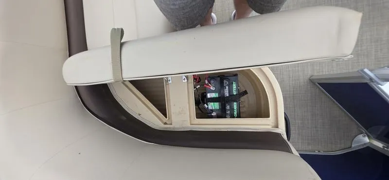 Slide: The Image of 2017 Sun Tracker Party Barge 18 DLX seat storage with battery compartment. - 18