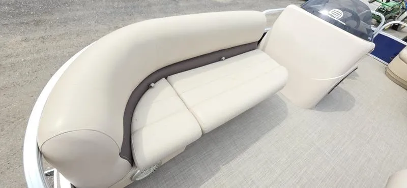 Slide: The Image of 2017 Sun Tracker Party Barge 18 DLX with beige seating and console. - 5