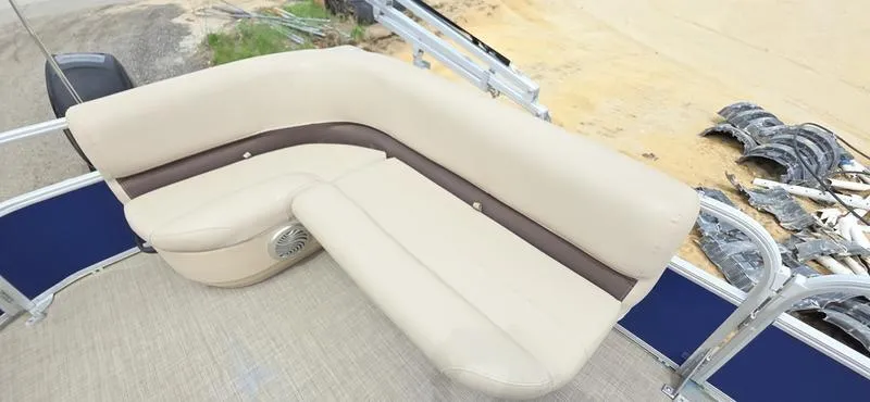 Slide: The Image of 2017 Sun Tracker Party Barge 18 DLX with beige seating on deck. - 8