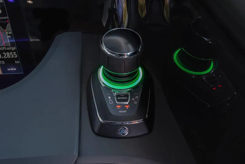 Slide: The Image of Control panel of 2025 Axopar 45 XC Cross Cabin with illuminated joystick. - 24