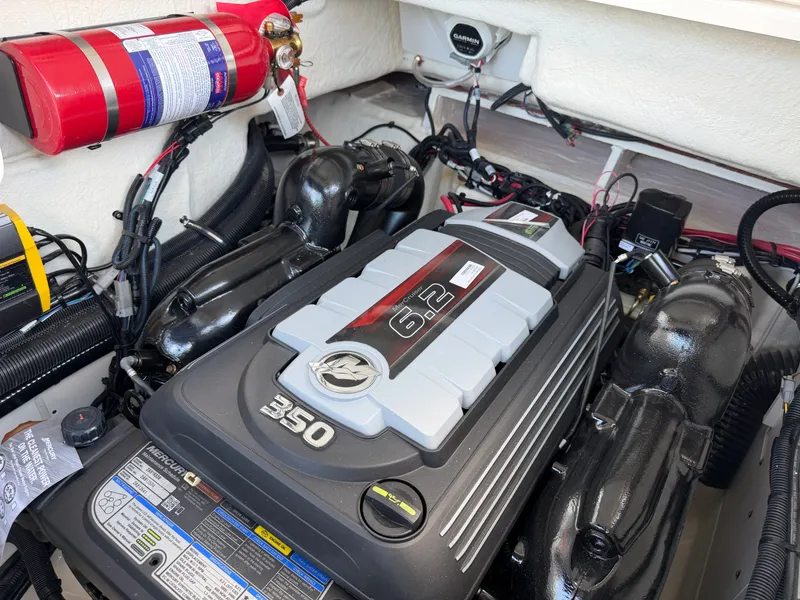 Slide: The Image of Engine compartment of a Sea Ray SLX 260 with a 6.2-liter engine and fire extinguisher. - 46