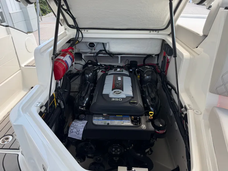 Slide: The Image of The engine compartment of a 2026 Sea Ray SLX 260 features a powerful 350 HP engine. - 45