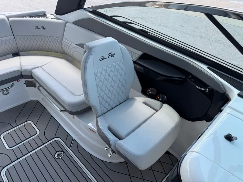 Slide: The Image of Interior of a Sea Ray SLX 260 boat with sleek, upholstered seating and modern design. - 38