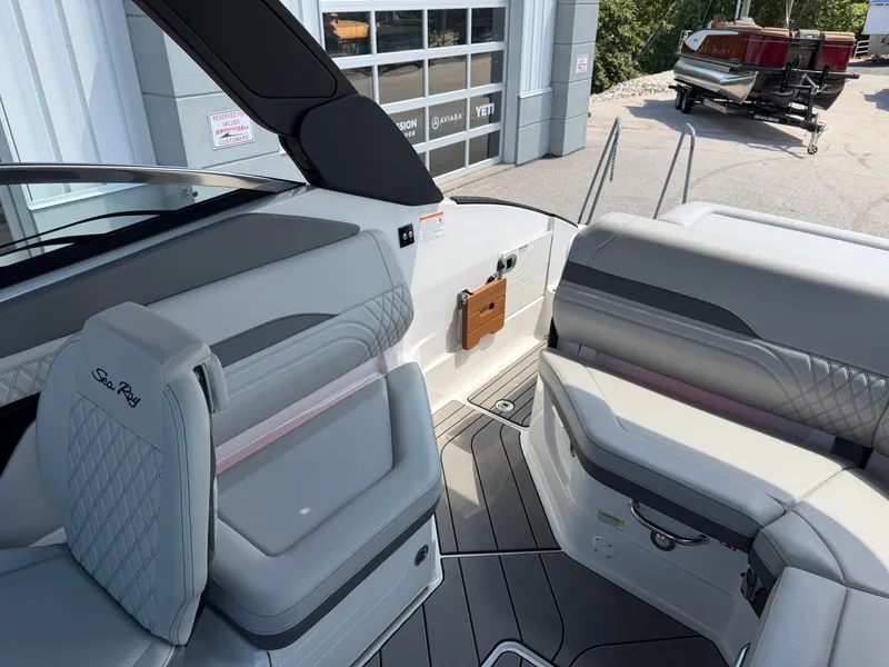 Slide: The Image of The image shows the interior of a 2026 Sea Ray SLX 260 boat with sleek seating. - 37