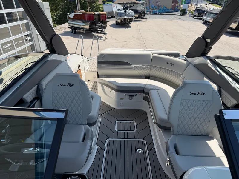 Slide: The Image of Interior of a 2026 Sea Ray SLX 260 with gray upholstery and modern design. - 35