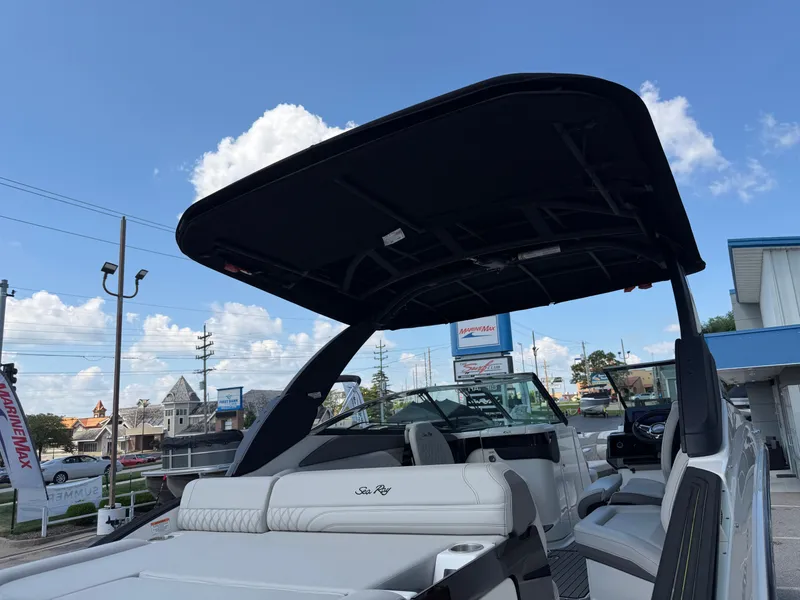 Slide: The Image of The image shows a 2026 Sea Ray SLX 260 boat with a sleek black canopy. - 42