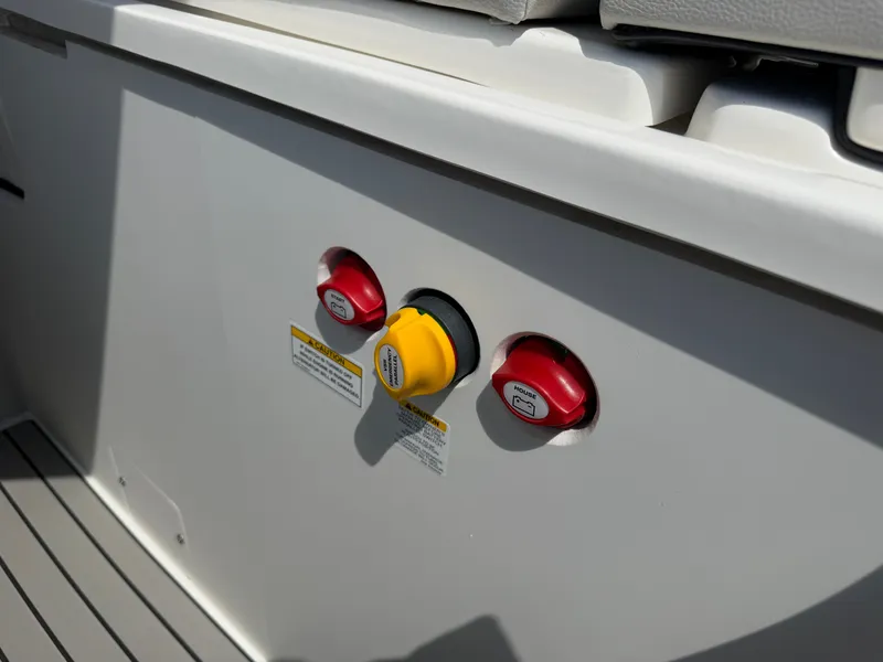 Slide: The Image of Close-up of switches on a 2026 Sea Ray SLX 260 boat. - 28