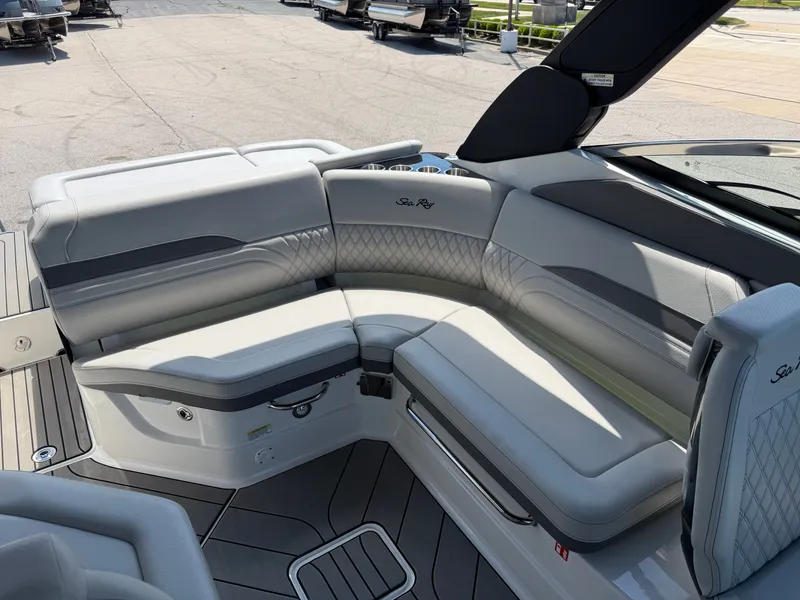Slide: The Image of The image shows the luxurious cockpit of a 2026 Sea Ray SLX 260 with elegant gray upholstery. - 36