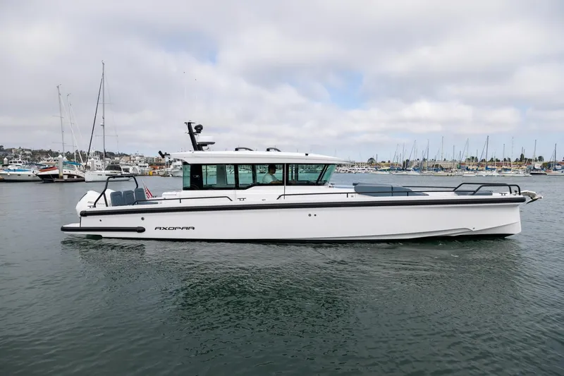 The Image of 2023 Axopar 37 XC Cross Cabin with BRABUS Trim and Wet Bar on water. - 0