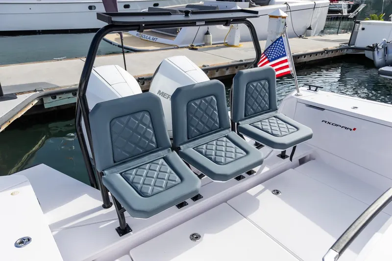 Slide: The Image of 2023 Axopar 37 XC Cross Cabin with BRABUS trim, featuring stylish seating and wet bar. - 13