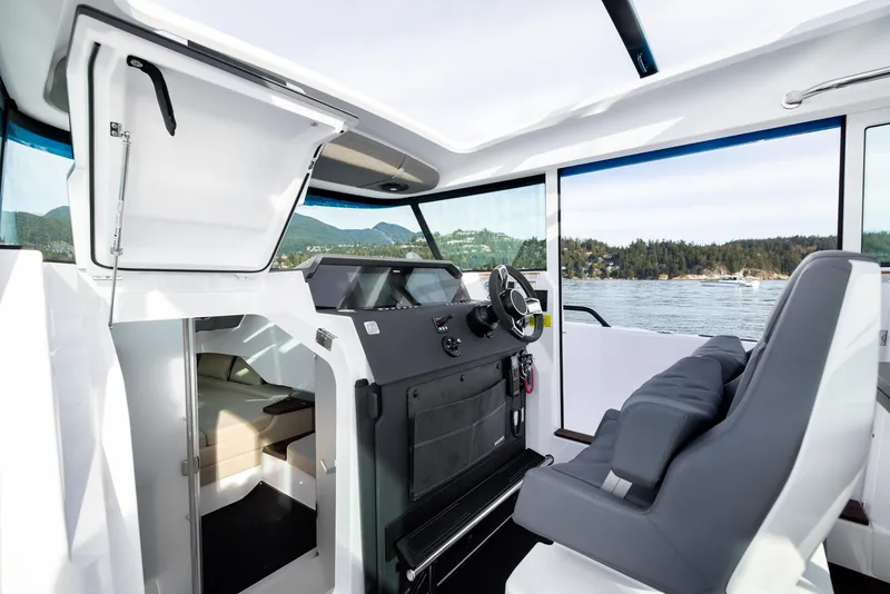 Slide: The Image of 2023 Axopar 37 XC Cross Cabin with BRABUS trim, featuring a sleek interior and wet bar. - 14