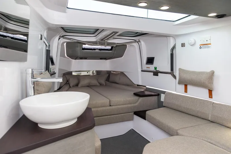 Slide: The Image of Luxurious interior of 2023 Axopar 37 XC Cross Cabin with modern design and comfortable seating. - 22