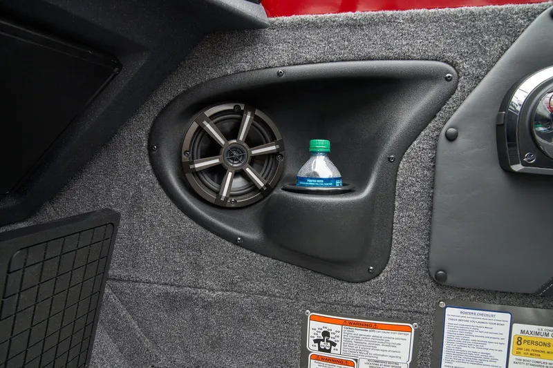 Slide: The Image of 2025 Tracker Targa V-19 Combo boat storage compartment, carpeted interior, and sleek design. - 41