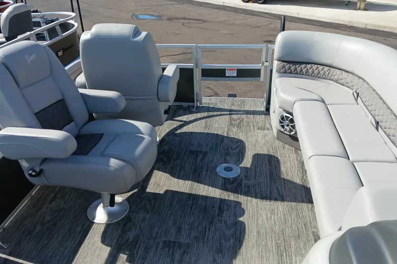 Slide: The Image of 2025 Ranger Reata 220FC boat interior with plush seating and modern design. - 10