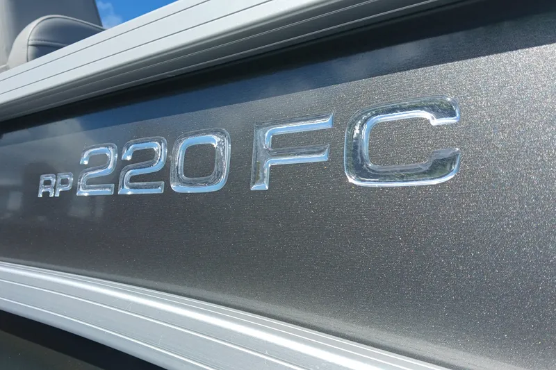Slide: The Image of 2025 Ranger Reata 220FC boat model emblem in metallic finish. - 1