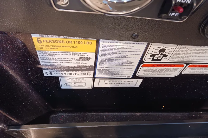 Slide: The Image of Boat capacity and safety labels on a 2025 Nitro ZV20, showing weight and passenger limits. - 8