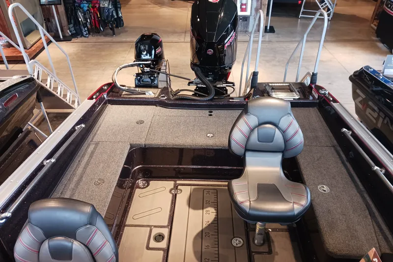Slide: The Image of 2025 Nitro ZV20 boat interior with seating and motor, displayed in showroom. - 5