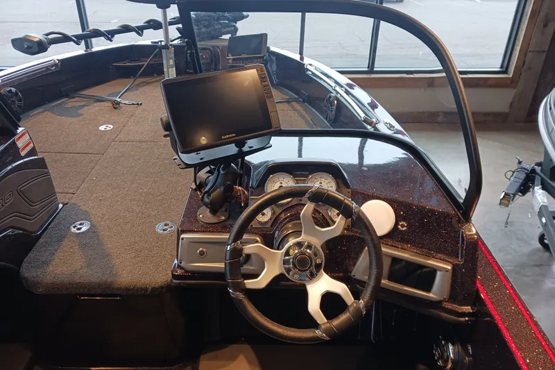 Slide: The Image of 2025 Nitro ZV20 boat dashboard with steering wheel and Garmin display. - 4
