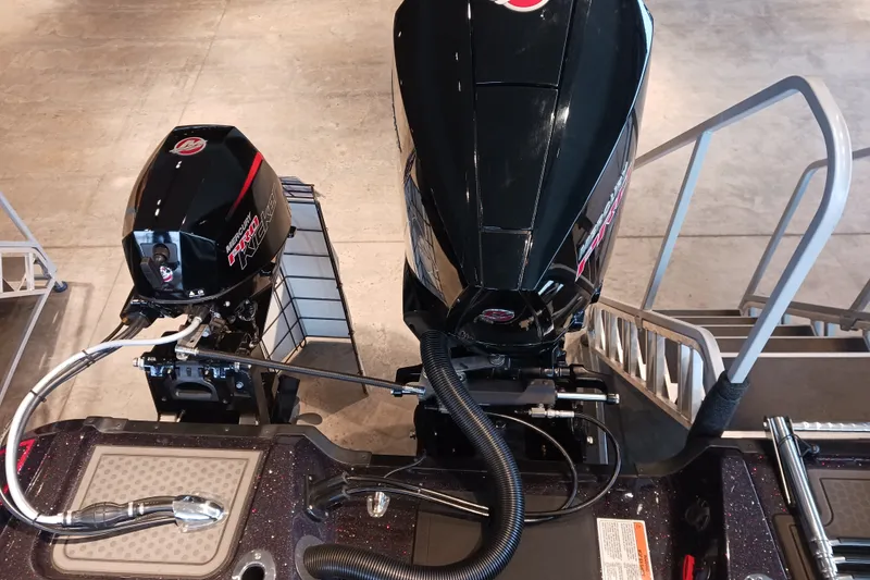 Slide: The Image of Nitro ZV20 2025 boat engines displayed in showroom with sleek black design. - 9