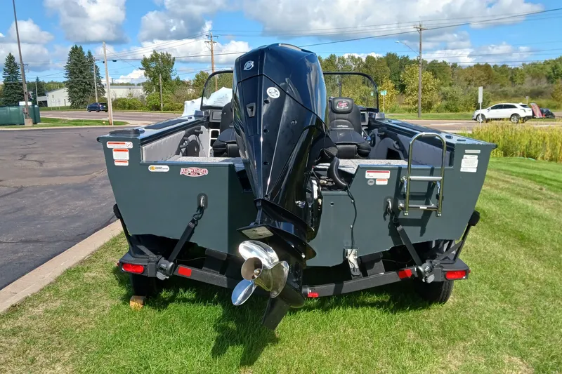 Slide: The Image of 2025 Ranger VX1888 WT boat with powerful outboard motor on grassy area. - 3