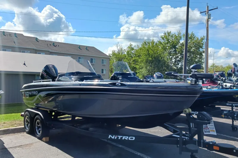 The Image of 2025 Nitro ZV19 boat on trailer under clear blue sky. - 0