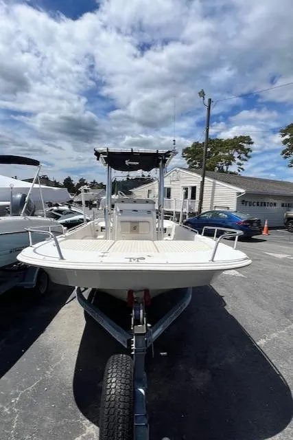 Slide: The Image of 2016 Carolina Skiff 218 DLV boat on trailer under cloudy sky. - 2