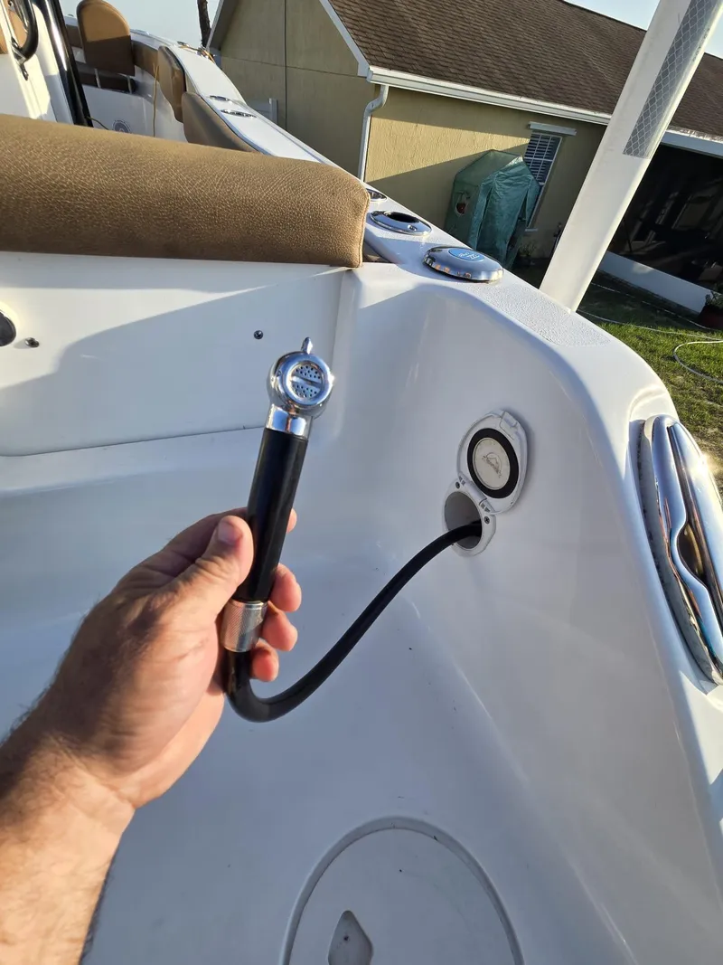 Slide: The Image of 2022 Sea Hunt Gamefish 30 boat with forward seating and hose connection detail. - 11