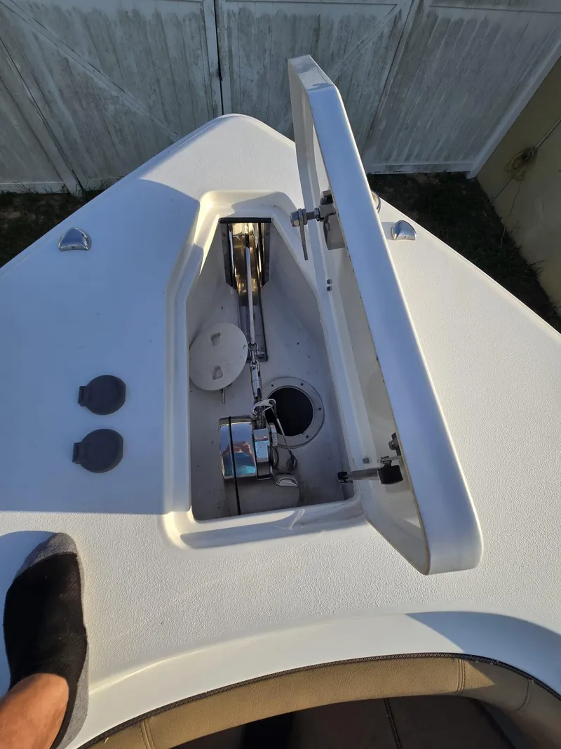 Slide: The Image of 2022 Sea Hunt Gamefish 30 Forward Seating anchor compartment with open hatch. - 14