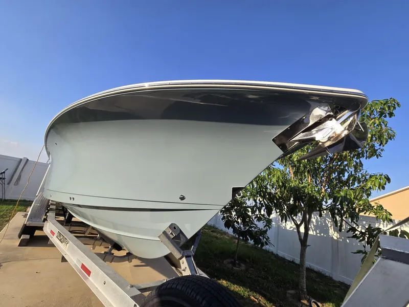 Slide: The Image of 2022 Sea Hunt Gamefish 30 Forward Seating boat on trailer, side view. - 34