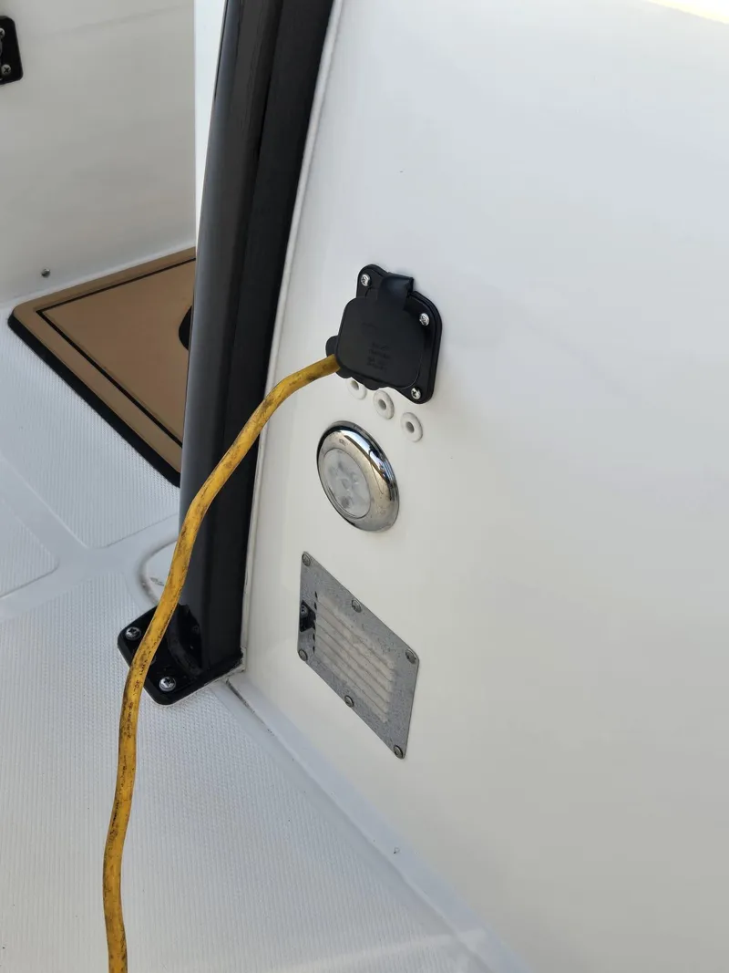 Slide: The Image of 2022 Sea Hunt Gamefish 30 boat with power connection and control panel. - 37