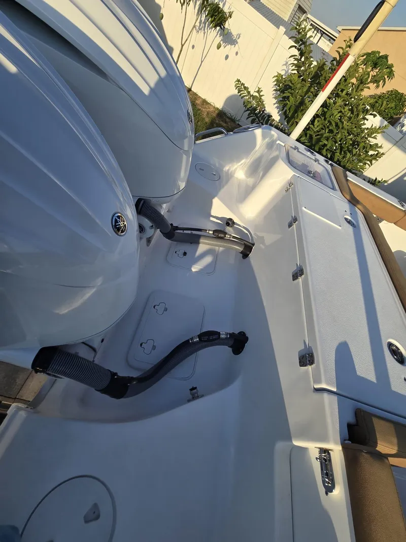 Slide: The Image of 2022 Sea Hunt Gamefish 30 Forward Seating boat with dual engines, showcasing sleek design. - 40