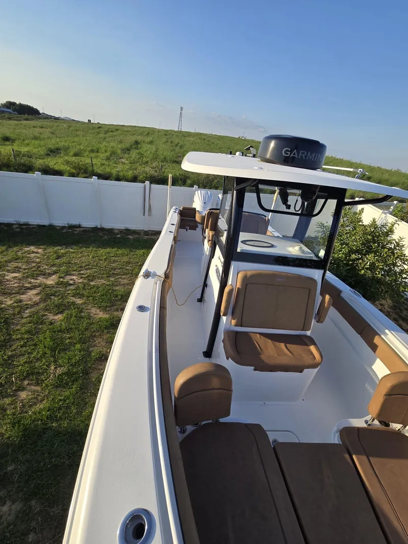 Slide: The Image of 2022 Sea Hunt Gamefish 30 Forward Seating boat with Garmin equipment, parked outdoors. - 43